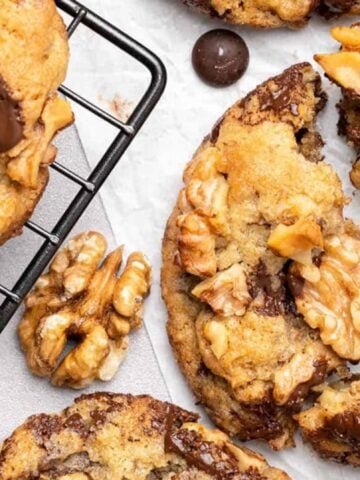 chocolate chip walnut cookies on cooling rack