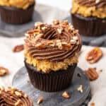 German chocolate cupcakes on a cutting board.
