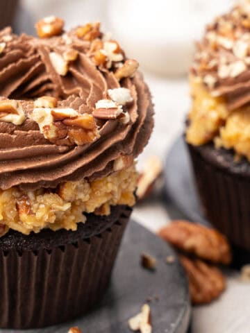 German chocolate cupcakes on a cutting board.