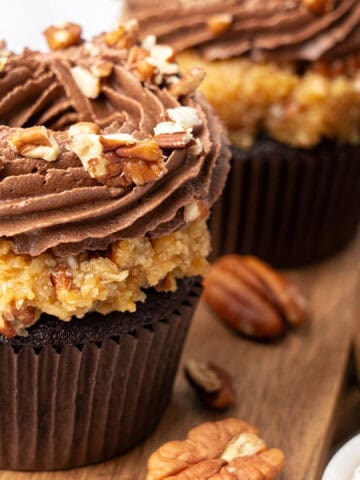 German chocolate cupcakes on a cutting board.