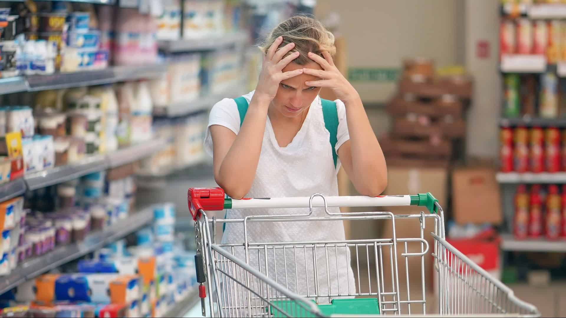woman stressed in the grocery store