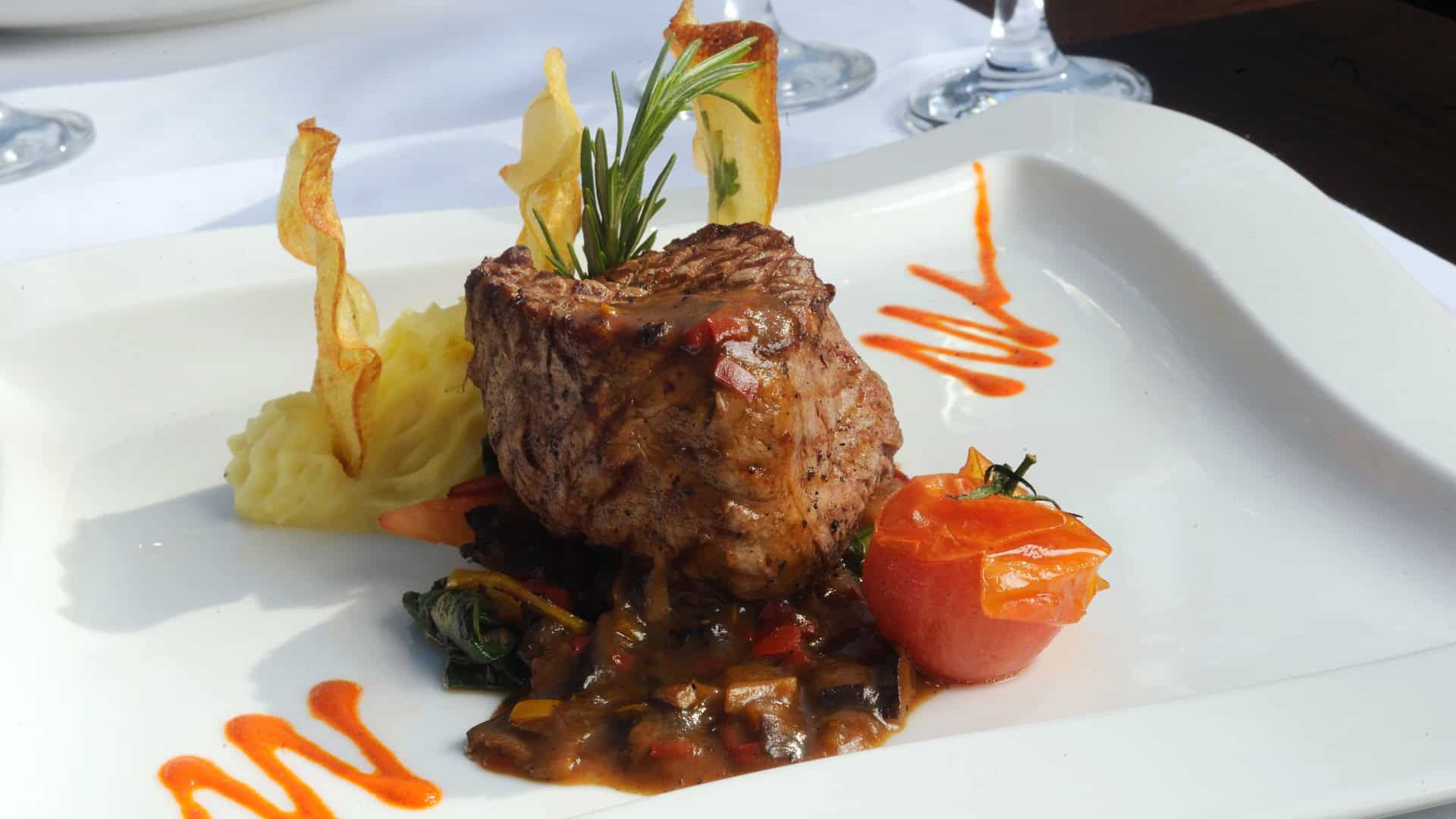 Fancy steak dinner on a white plate