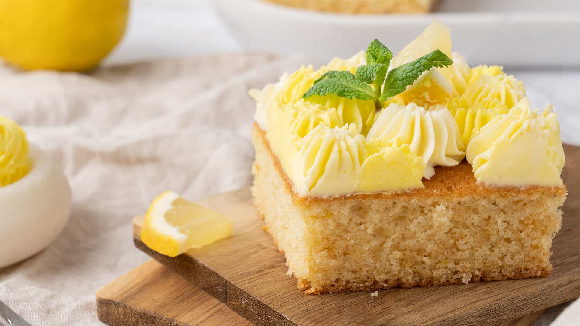 A slice of lemon sheet cake.