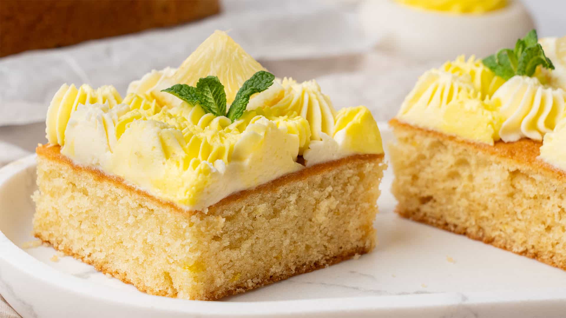 A slice of lemon sheet cake.