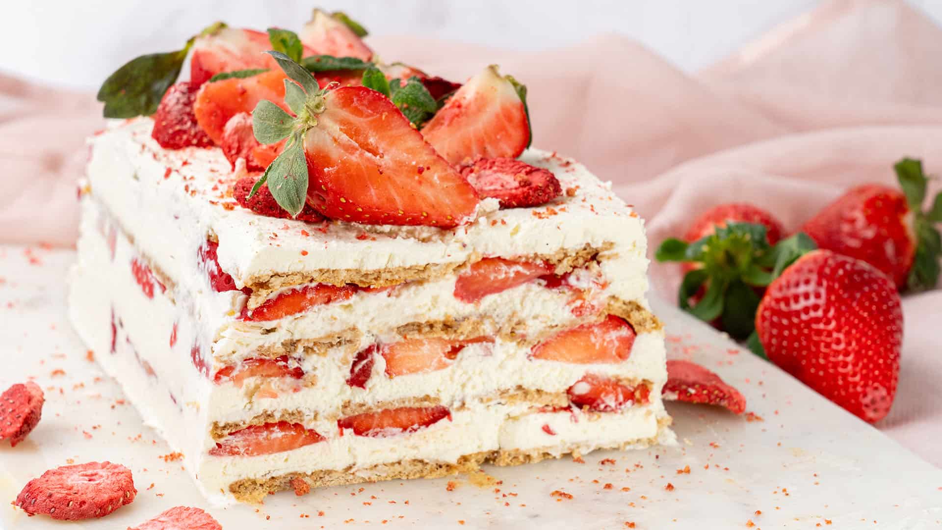 Strawberry Icebox Cake on a cutting board.