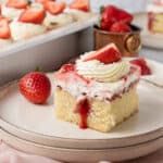 A slice of strawberry poke cake.