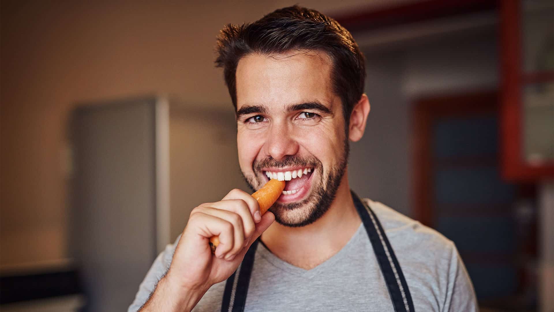 man eating carrot.