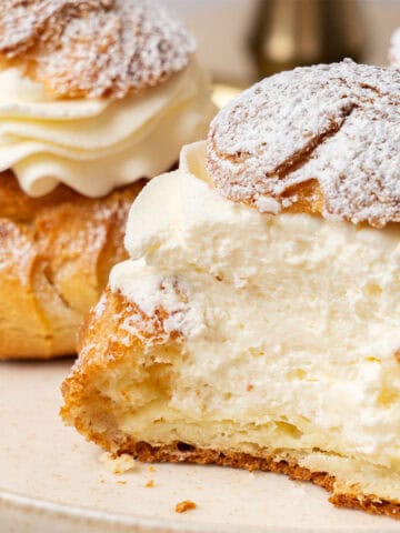 A half cream puff on a plate.