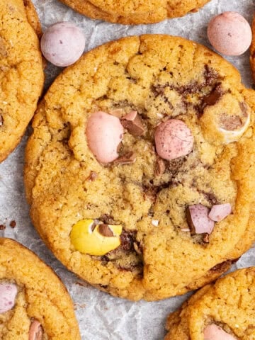 A few Easter egg cookies on a plate.