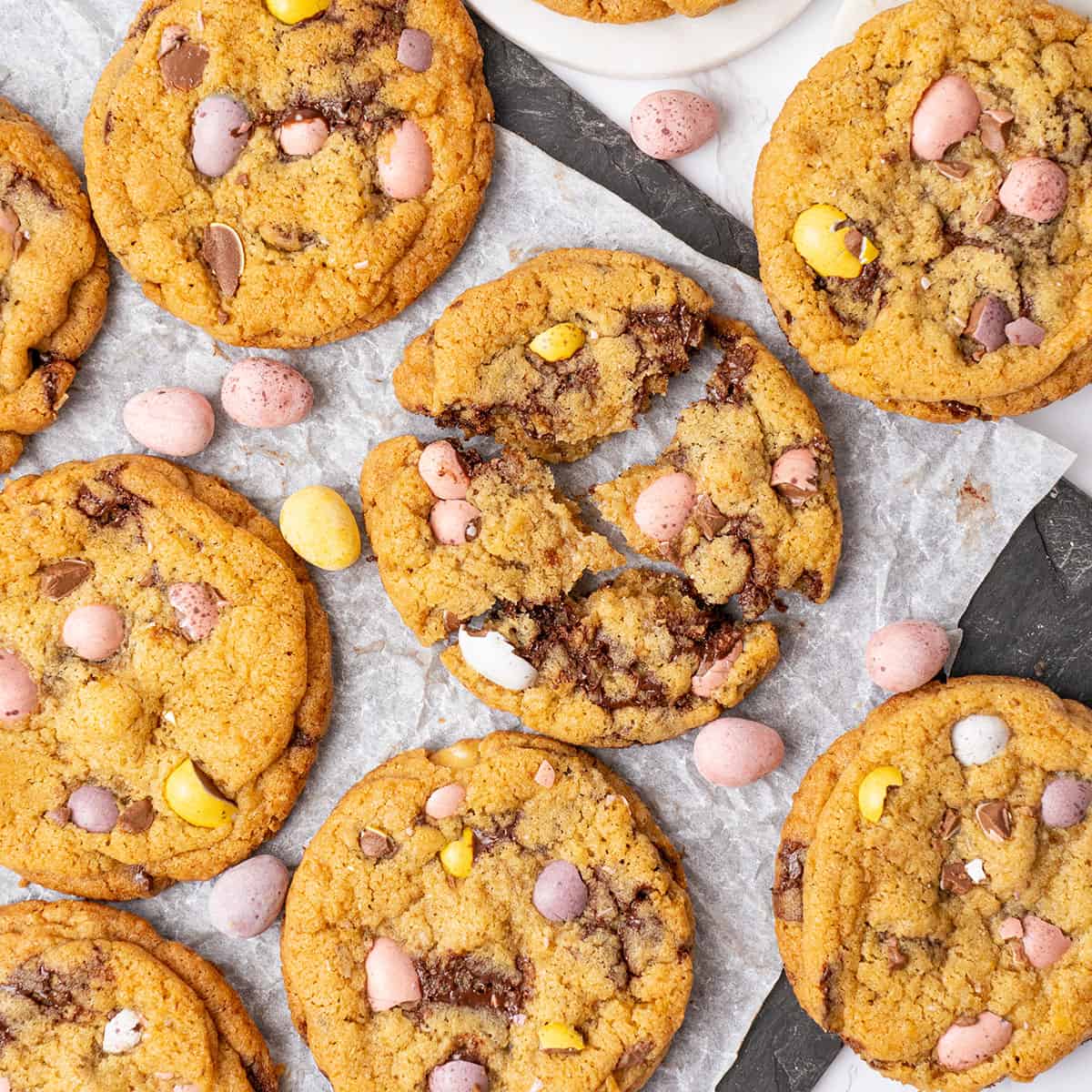 A few Easter egg cookies on a plate.