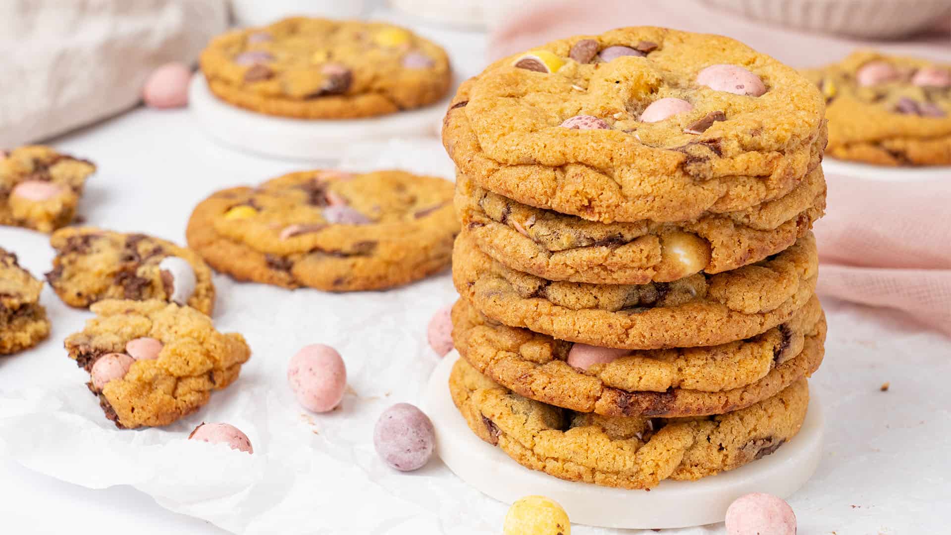 A few Easter egg cookies on a plate.