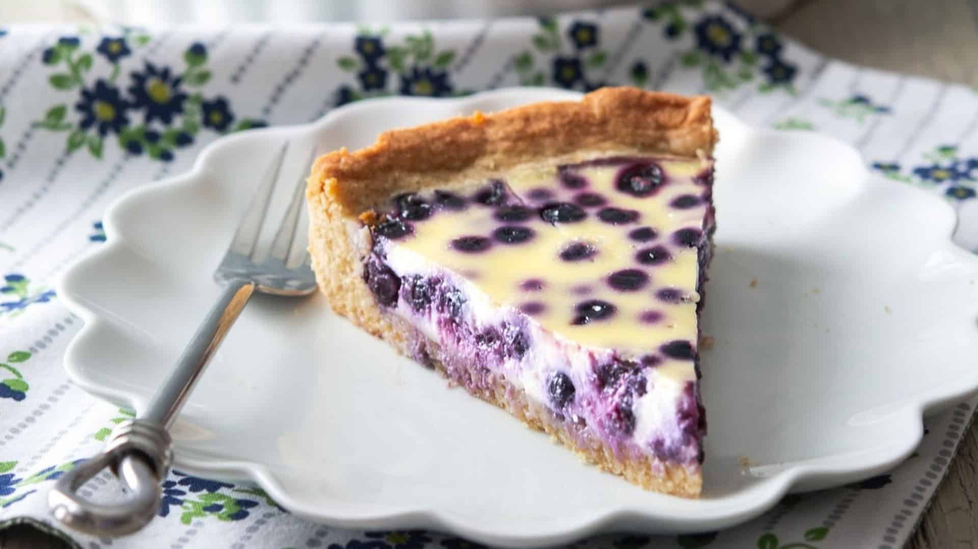 Slice of finnishblueberry pie on a plate