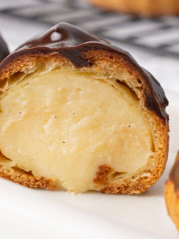 A half Profiterole filled with pastry cream.