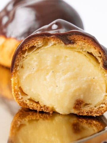 A half Profiterole filled with pastry cream.