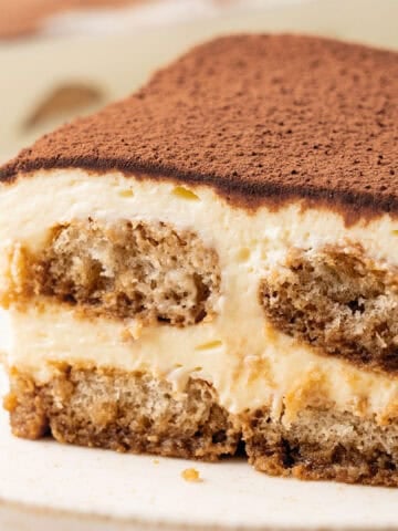 A slice of tiramisu on plate.