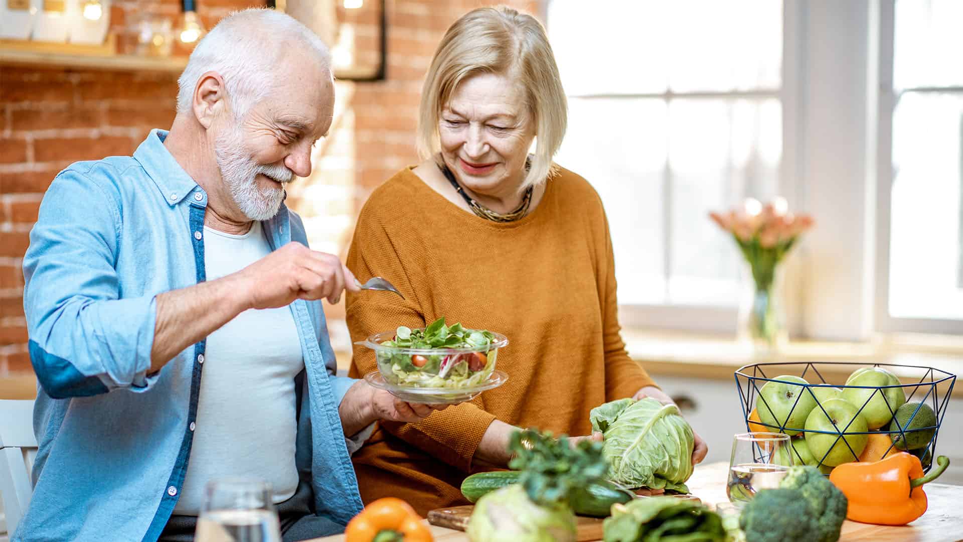 Old couple cooking.