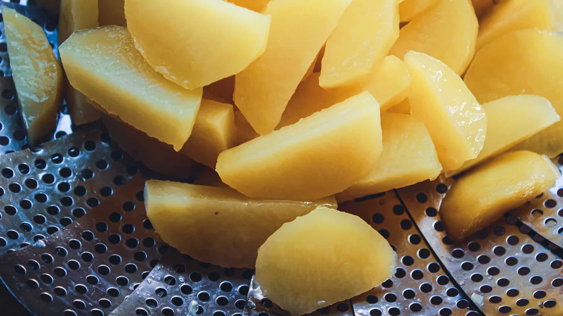 chopped boiled potatoes in a strainer