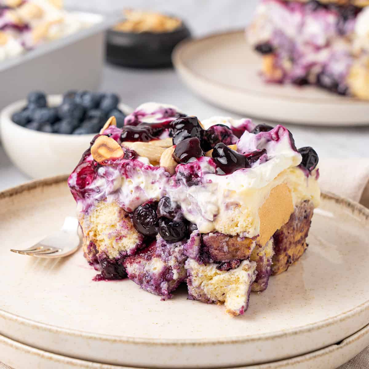 A slice of Blueberry Heaven On Earth Cake on a plate.