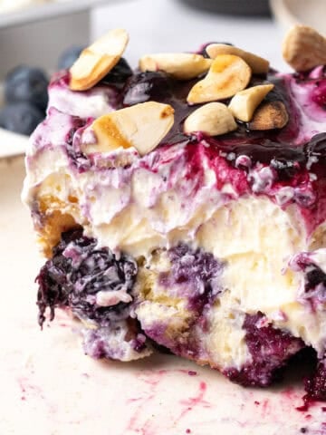 A slice of Blueberry Heaven On Earth Cake on a plate.