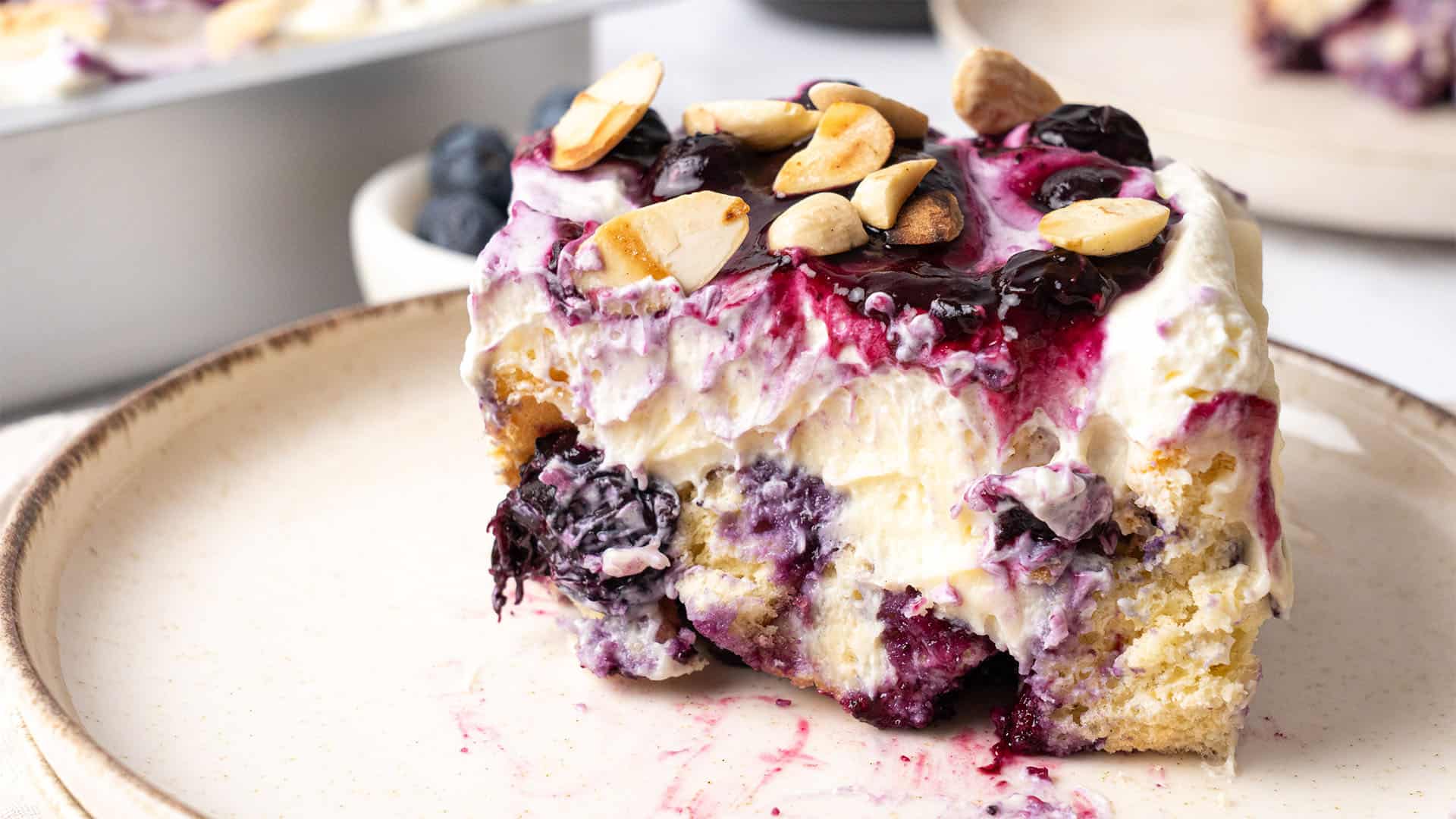 A slice of Blueberry Heaven On Earth Cake on a plate.