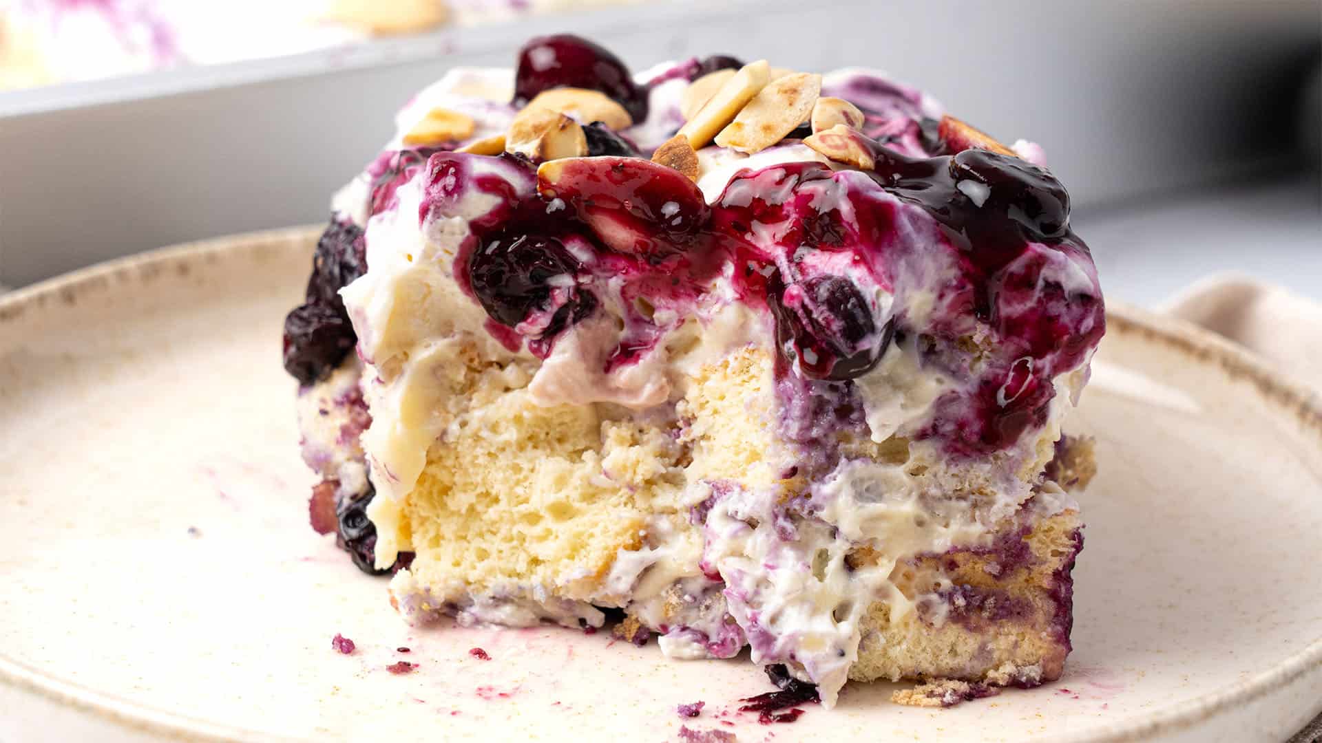 A slice of Blueberry Heaven On Earth Cake on a plate.