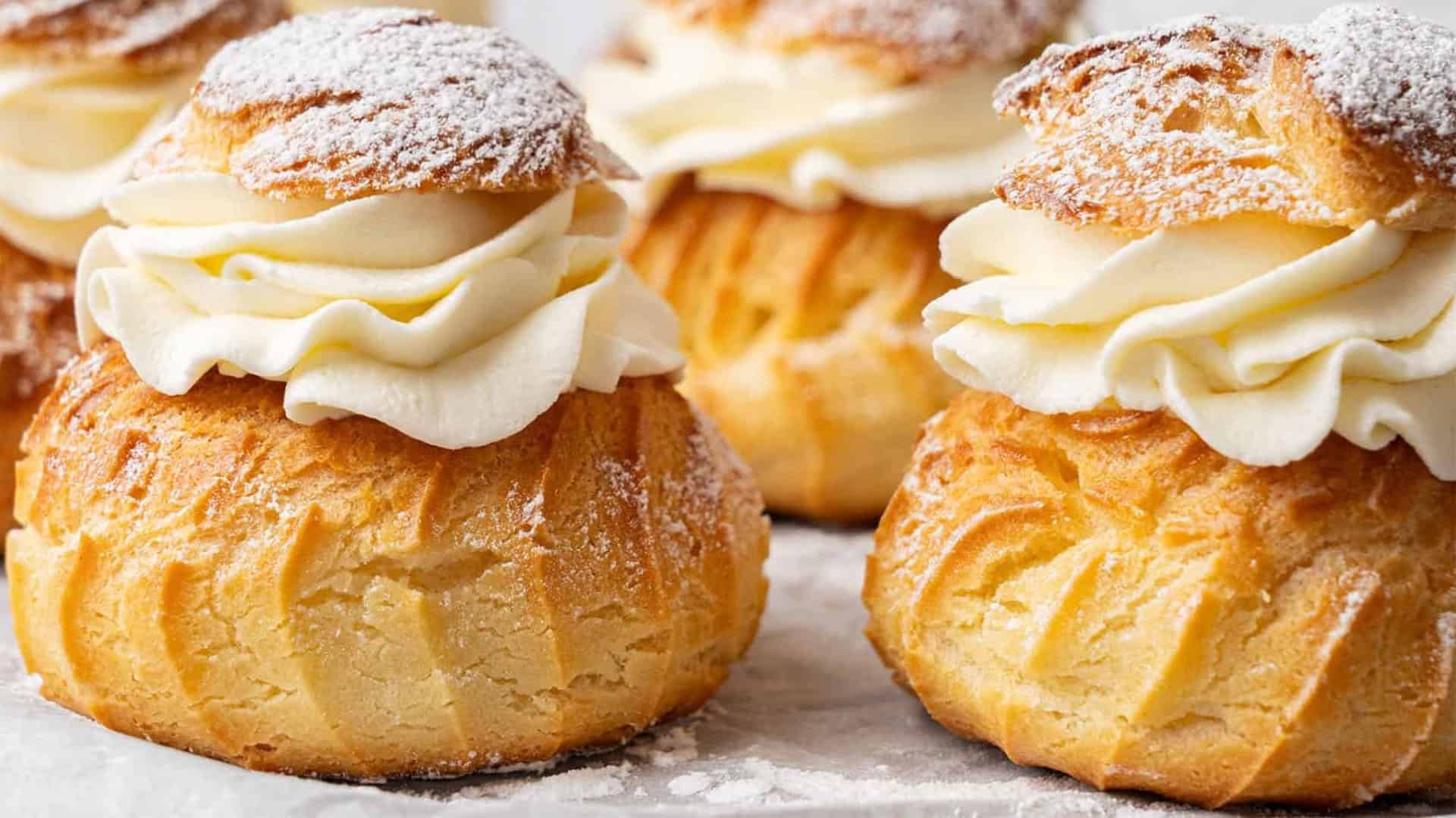 Homemade cream puffs with powdered sugae