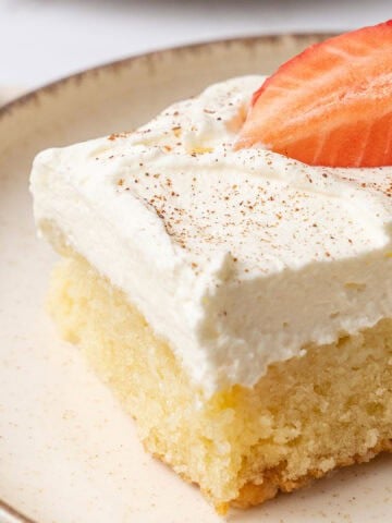 a slice of Tres Leches Cake on a plate.