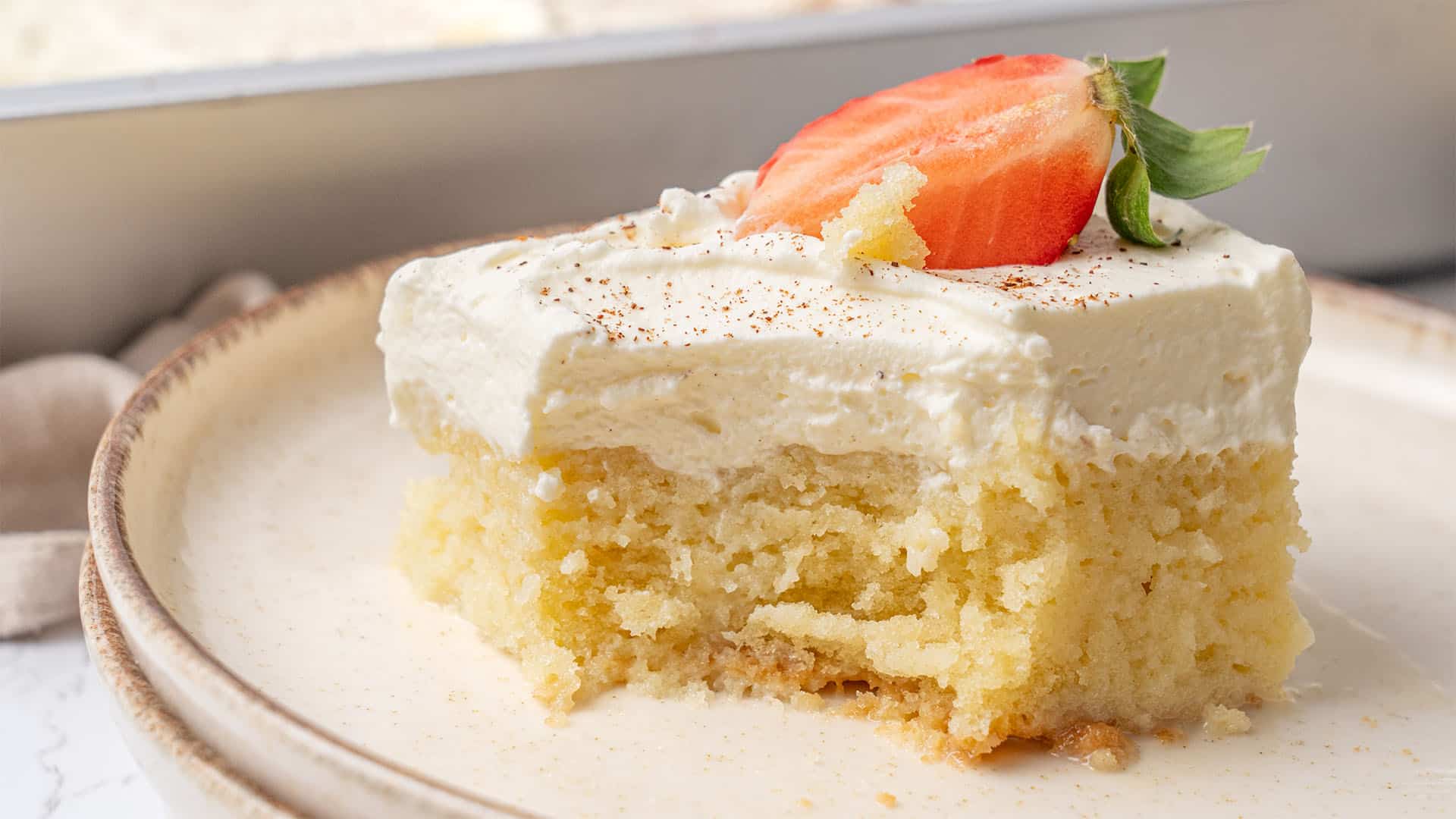 a slice of Tres Leches Cake on a plate.