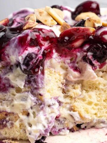 blueberry heaven on earth cake with sliced almonds and cream cheese