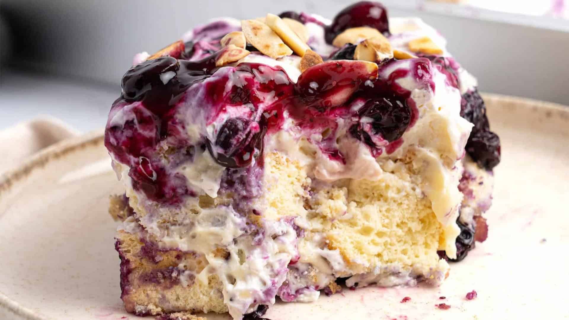 blueberry heaven on earth cake with sliced almonds and cream cheese