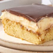A slice of Boston cream poke cake.