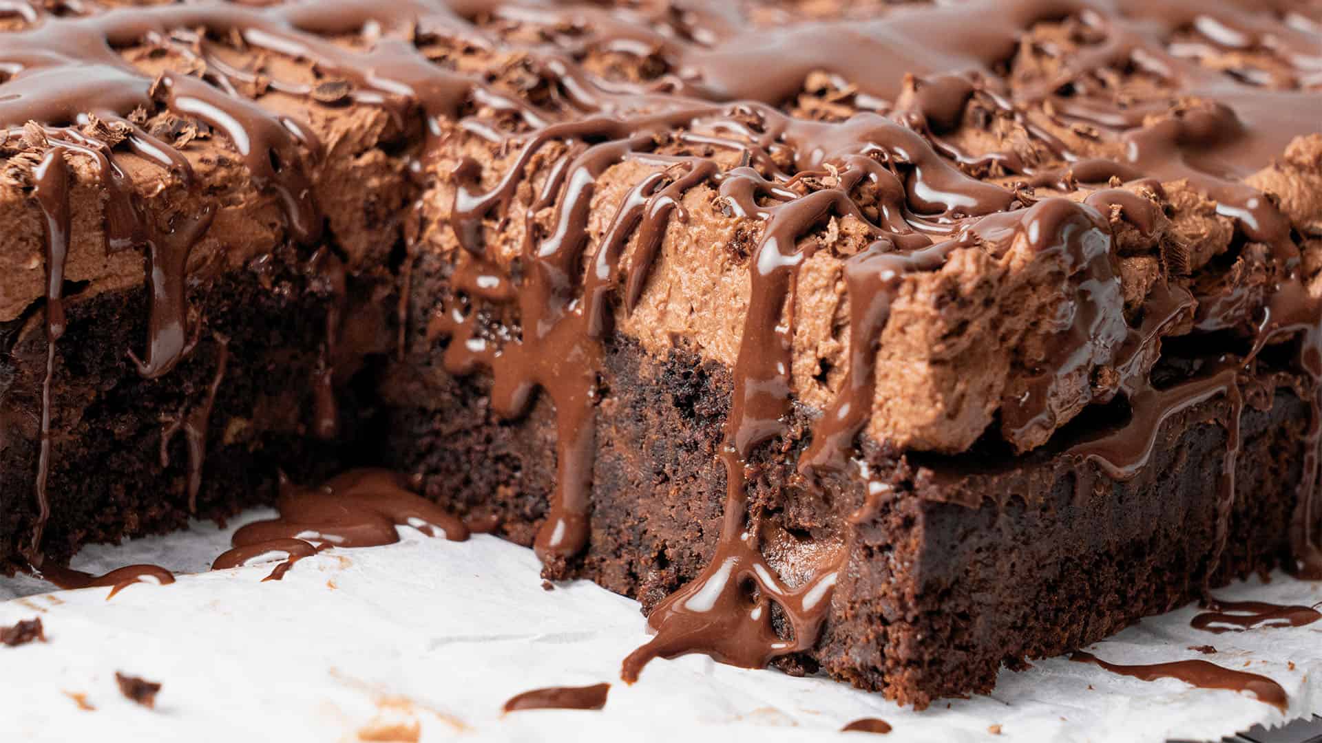 a slice of Chocolate Poke Cake on a plate.