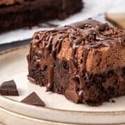 a slice of Chocolate Poke Cake on a plate.