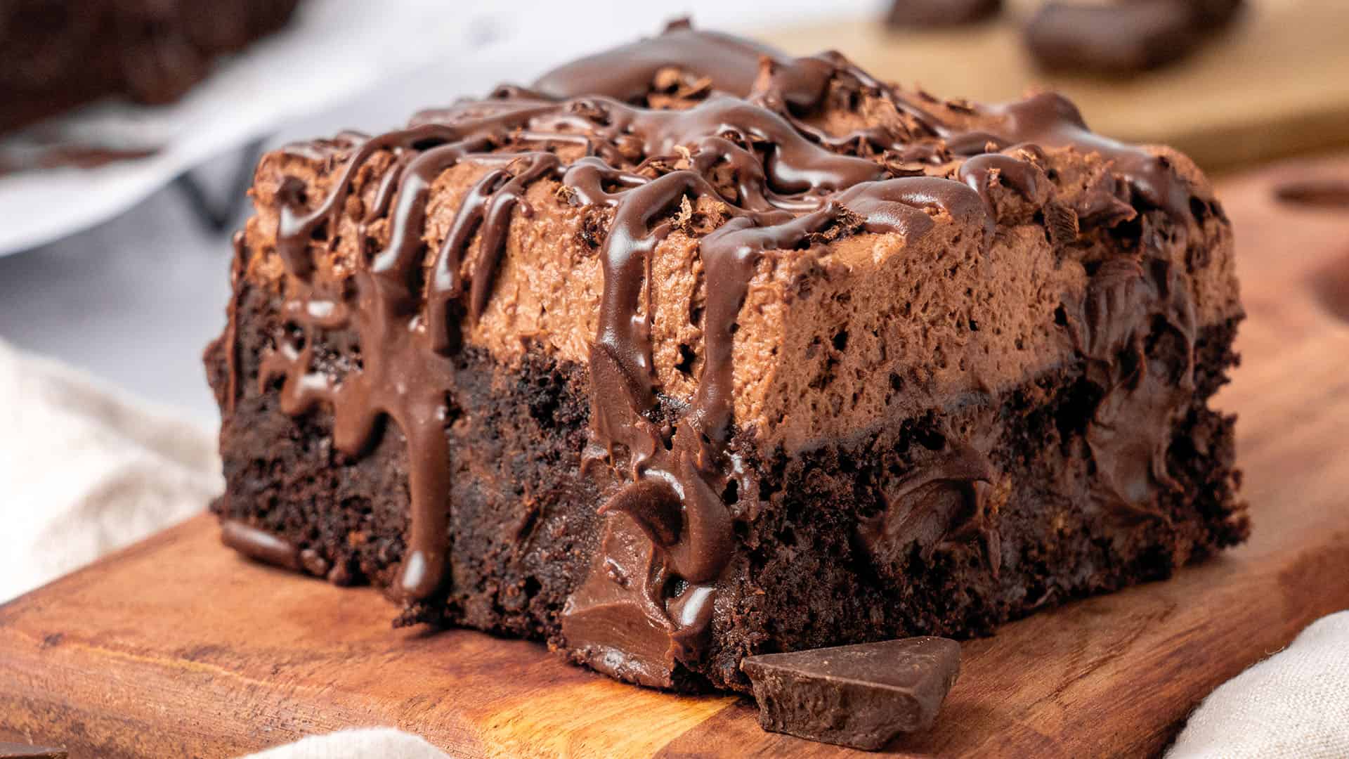 a slice of Chocolate Poke Cake on a plate.