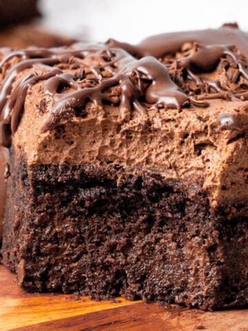 a slice of Chocolate Poke Cake on a plate.