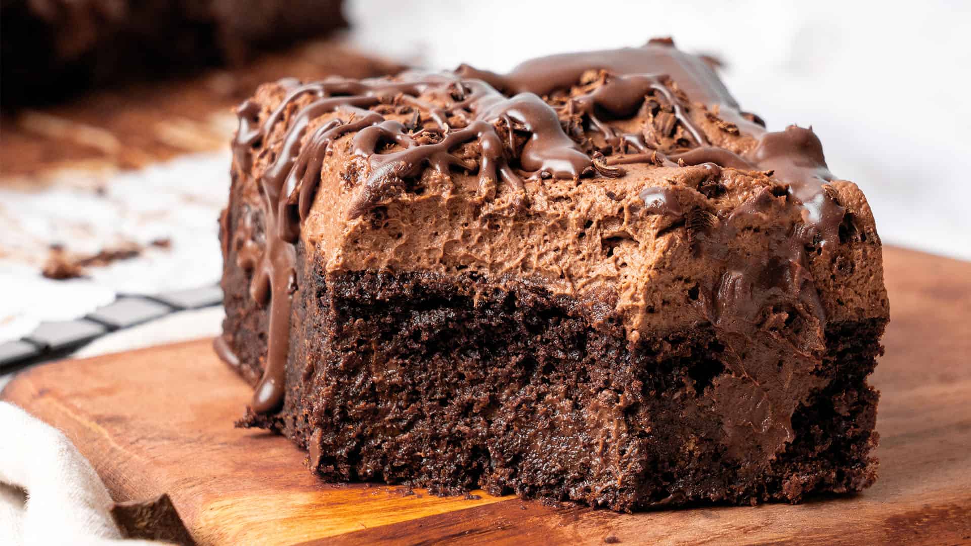 a slice of Chocolate Poke Cake on a plate.