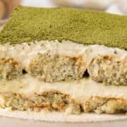 a slice of matcha tiramisu on a plate.