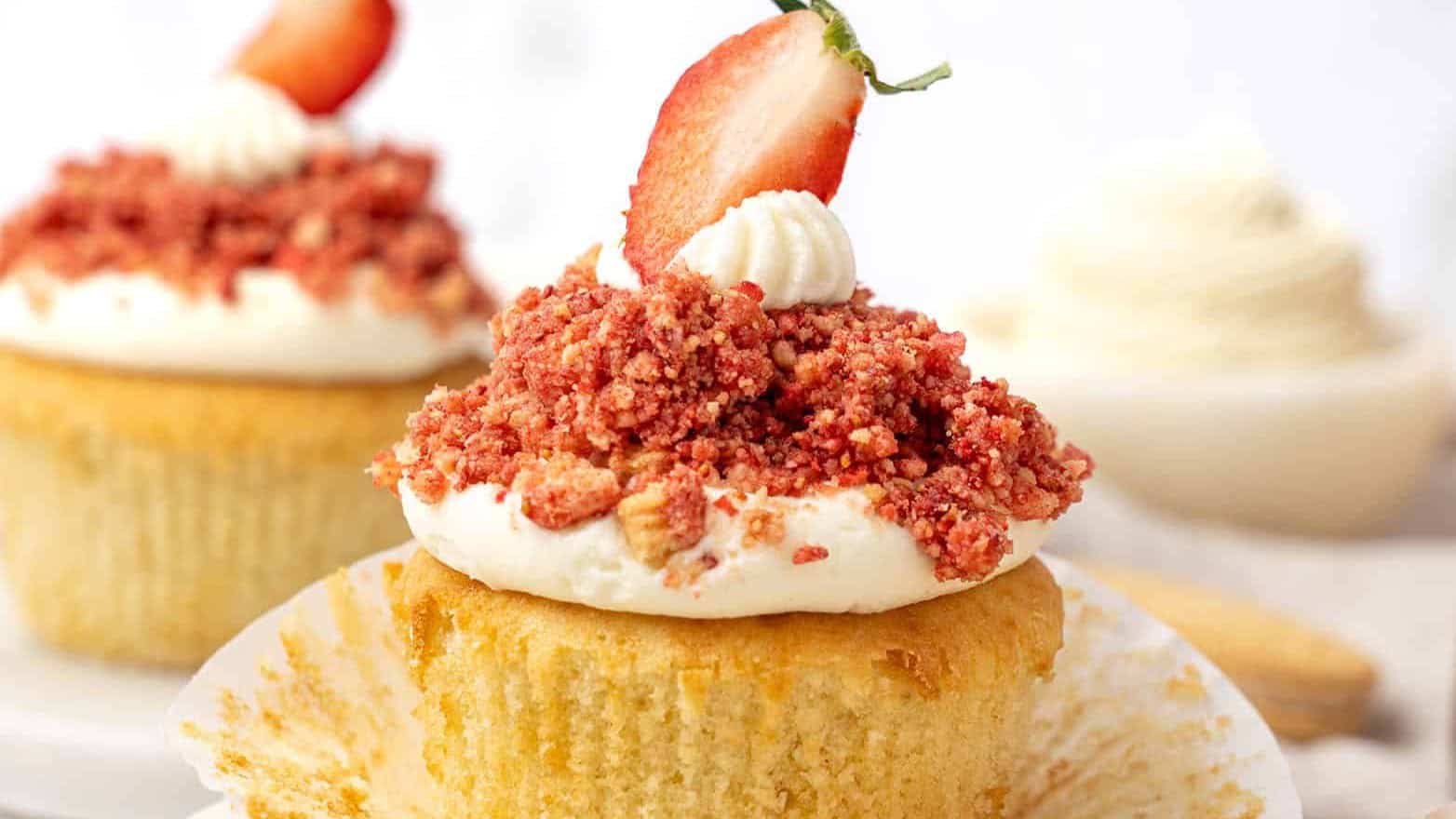 strawberry crunch cupcakes with fresh strawberry on top