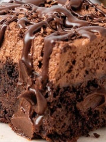 chocolate poke cake with chocolate sauce drizzle