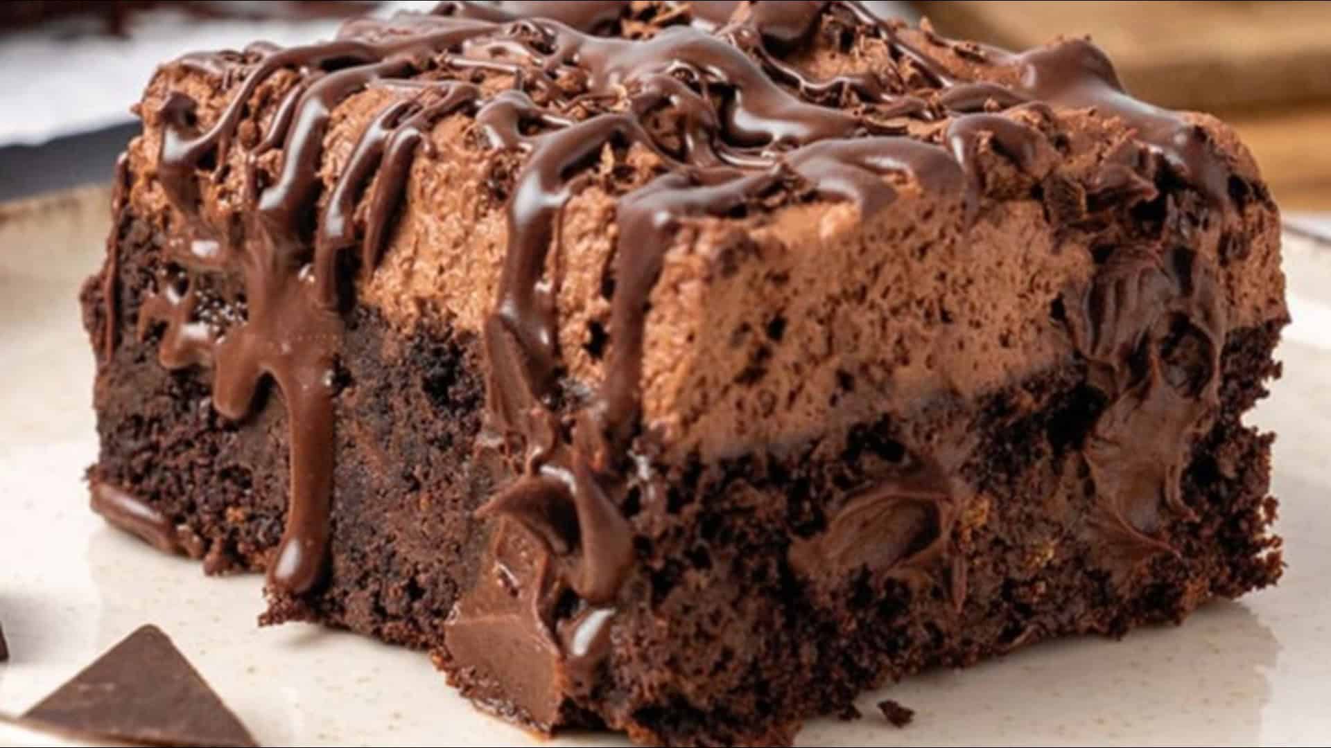 chocolate poke cake with chocolate sauce drizzle