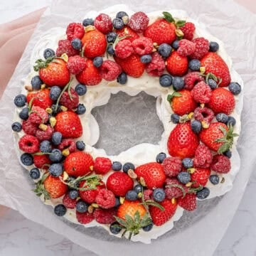 Pavlova wreath on a cake stand.