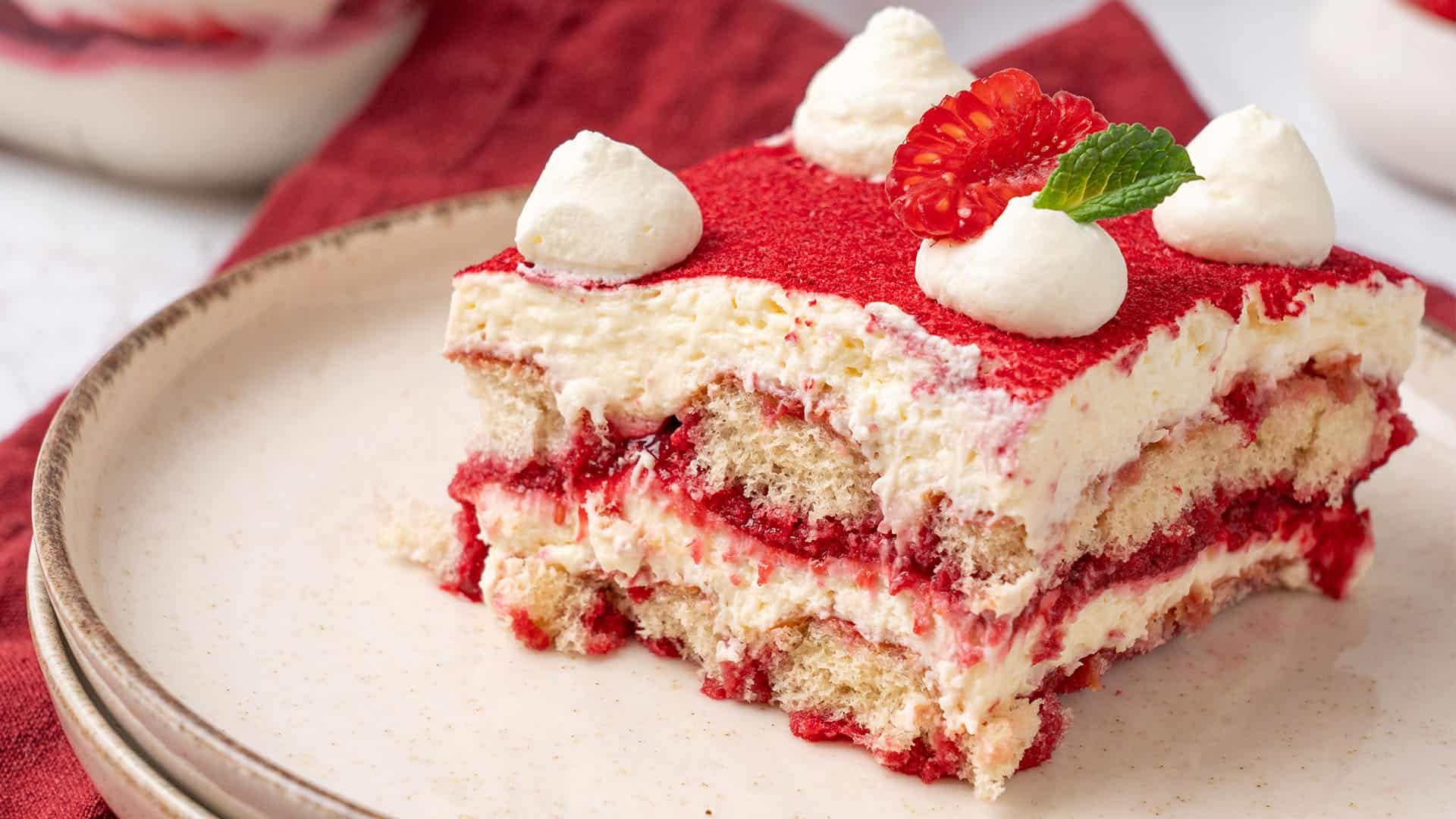 Raspberry tiramisu on a plate.