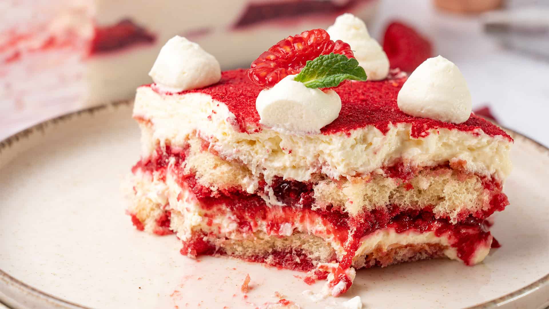 Raspberry tiramisu on a plate.
