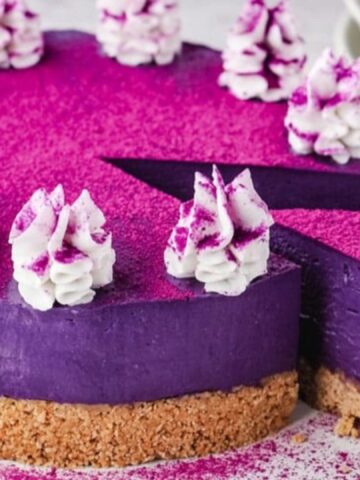 purple ube cheesecake with whipped cream
