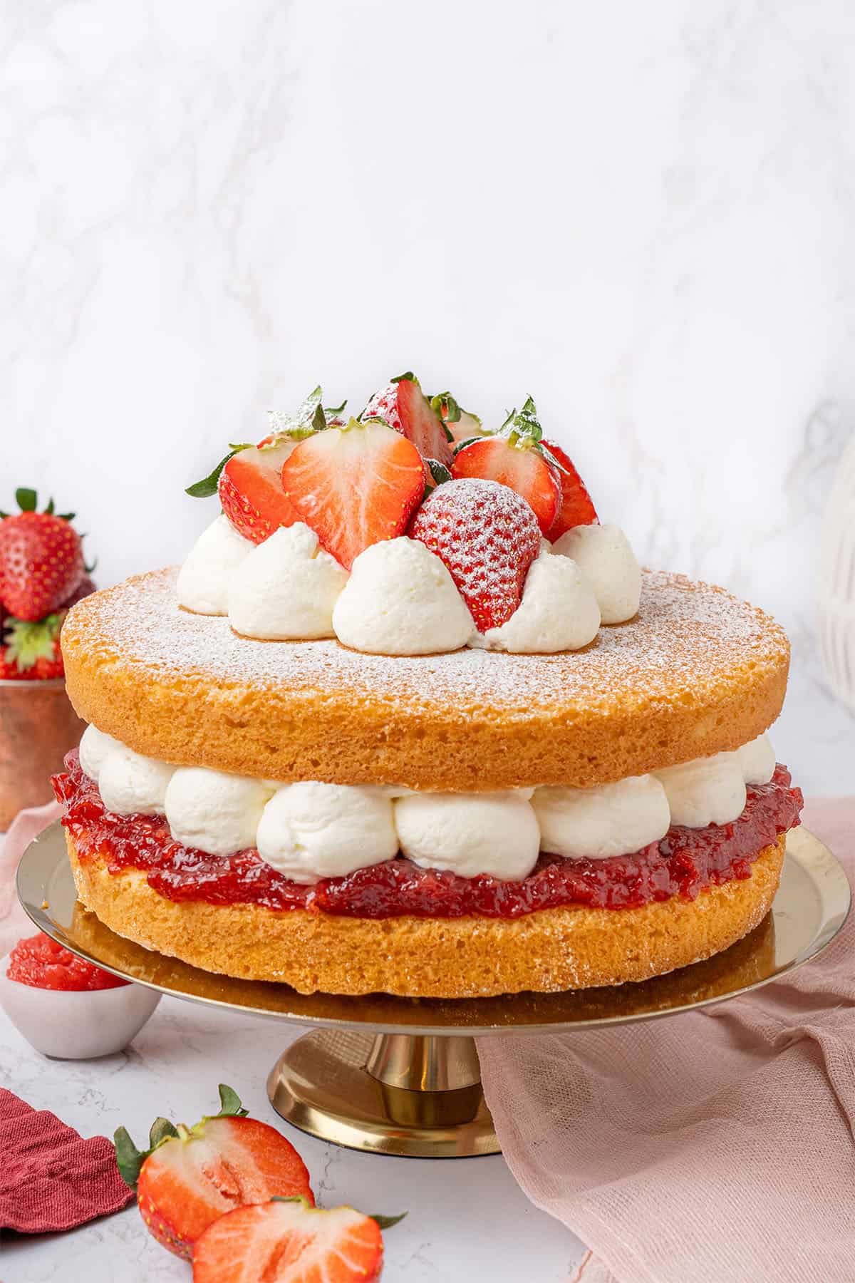 Victoria Sponge Cake on a cake stand.