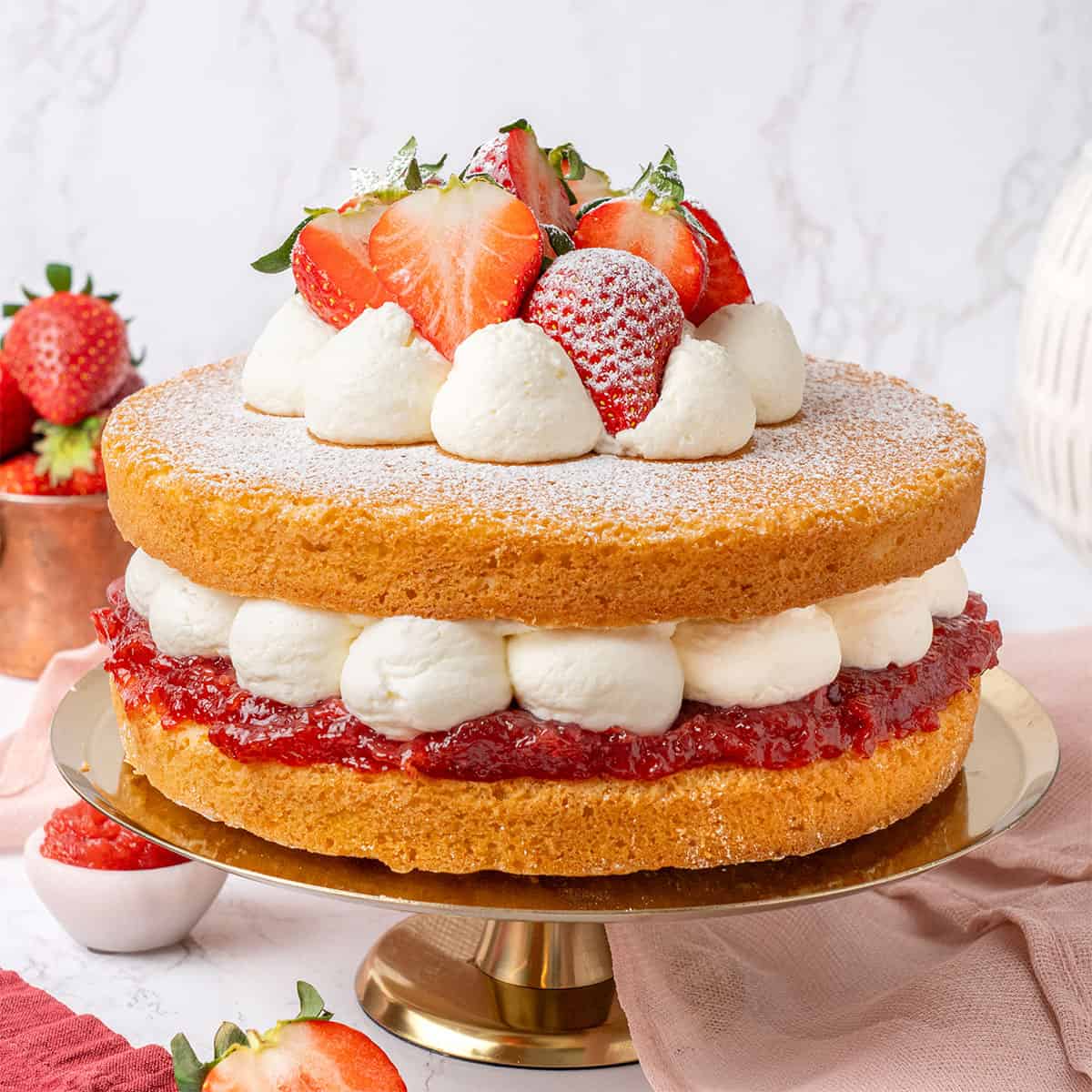 Victoria Sponge Cake on a cake stand.