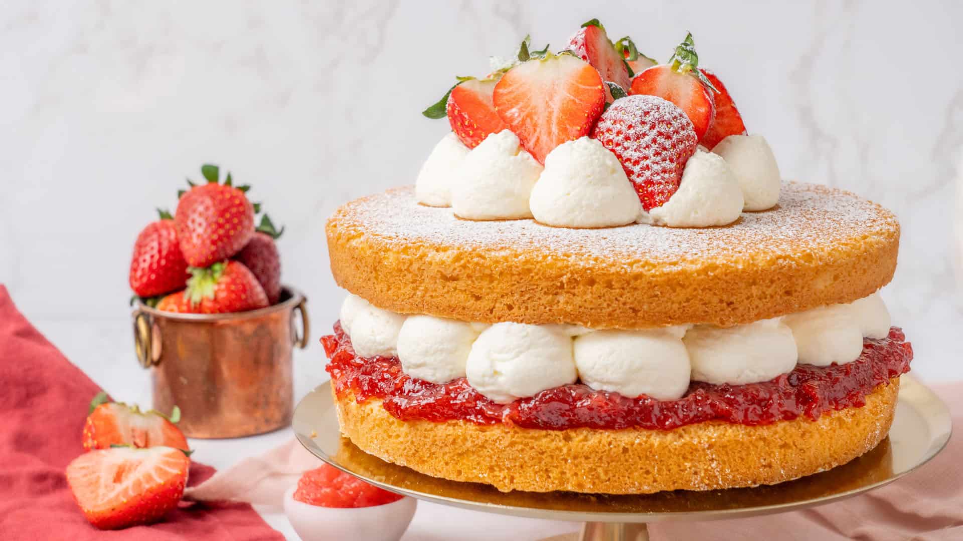 Victoria Sponge Cake on a cake stand.