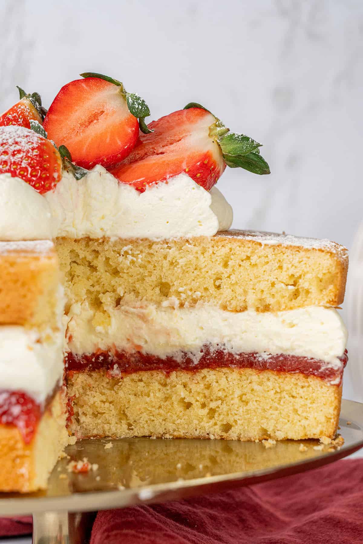 Victoria Sponge Cake on a cake stand.