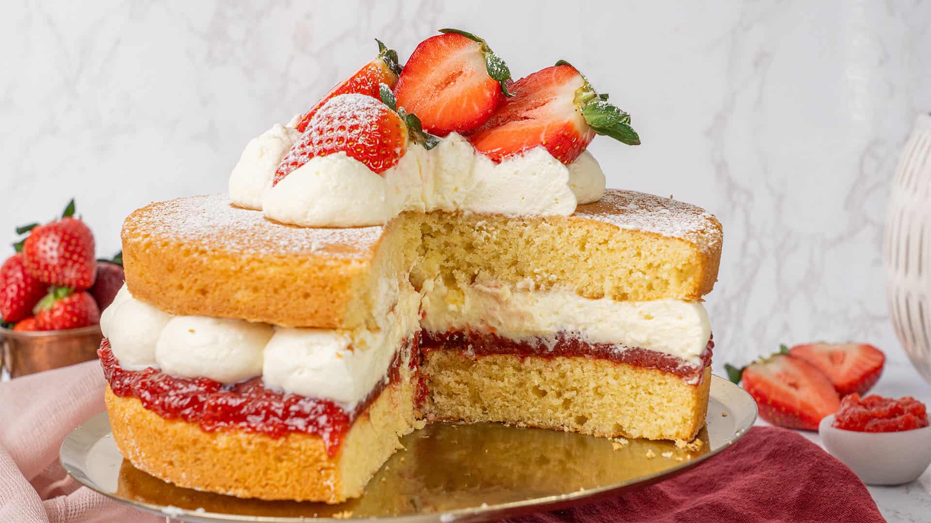 Victoria Sponge Cake on a cake stand.