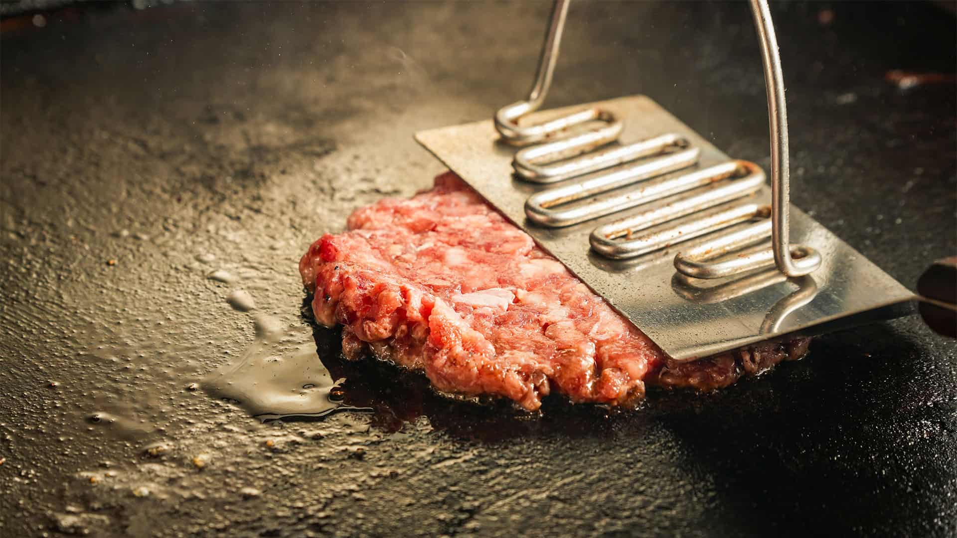 grilling burger. smashing burger